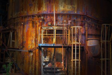 Detail of blast furnaces, rusty metal at abandoned factory