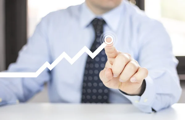 Man with growing graph — Stock Photo, Image