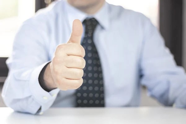 Man in office with OK sign — Stock Photo, Image