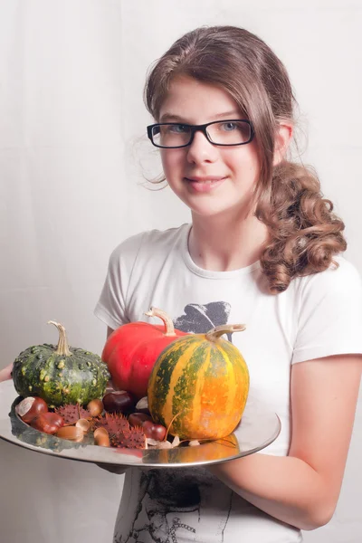 Girl with pumpkins — Stock Photo, Image