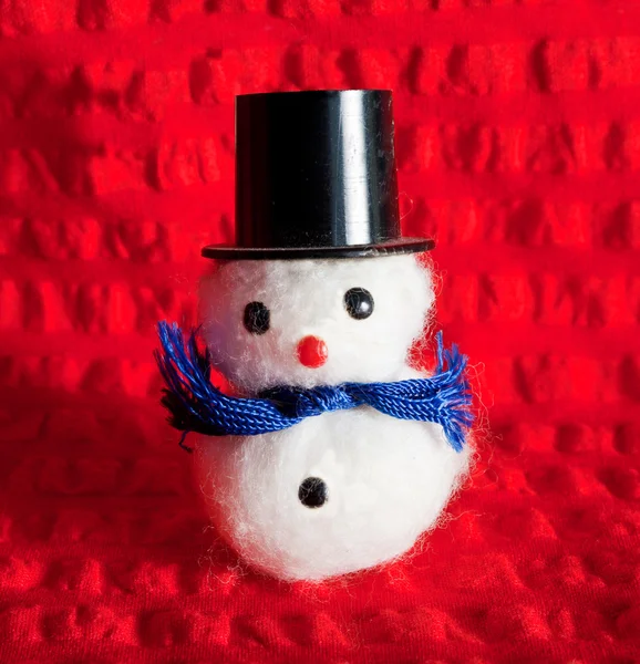 Christmas snowman on red background — Stock Photo, Image