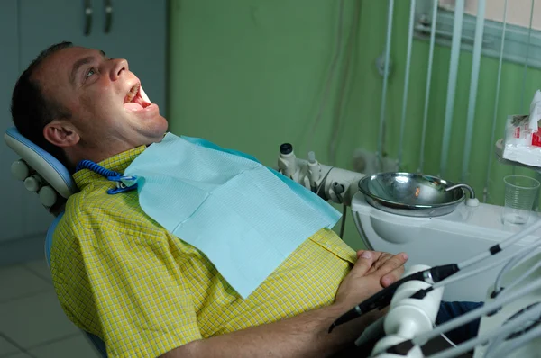 Patient in chair of dentist — Stock Photo, Image