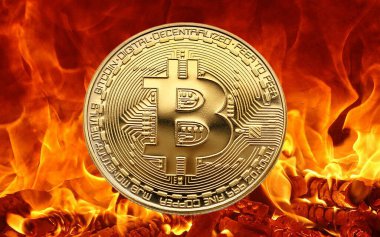 bitcoin coin in gold flames on a black background.