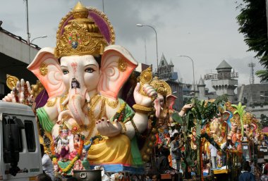 Ganesha idols are being transported for immersion clipart