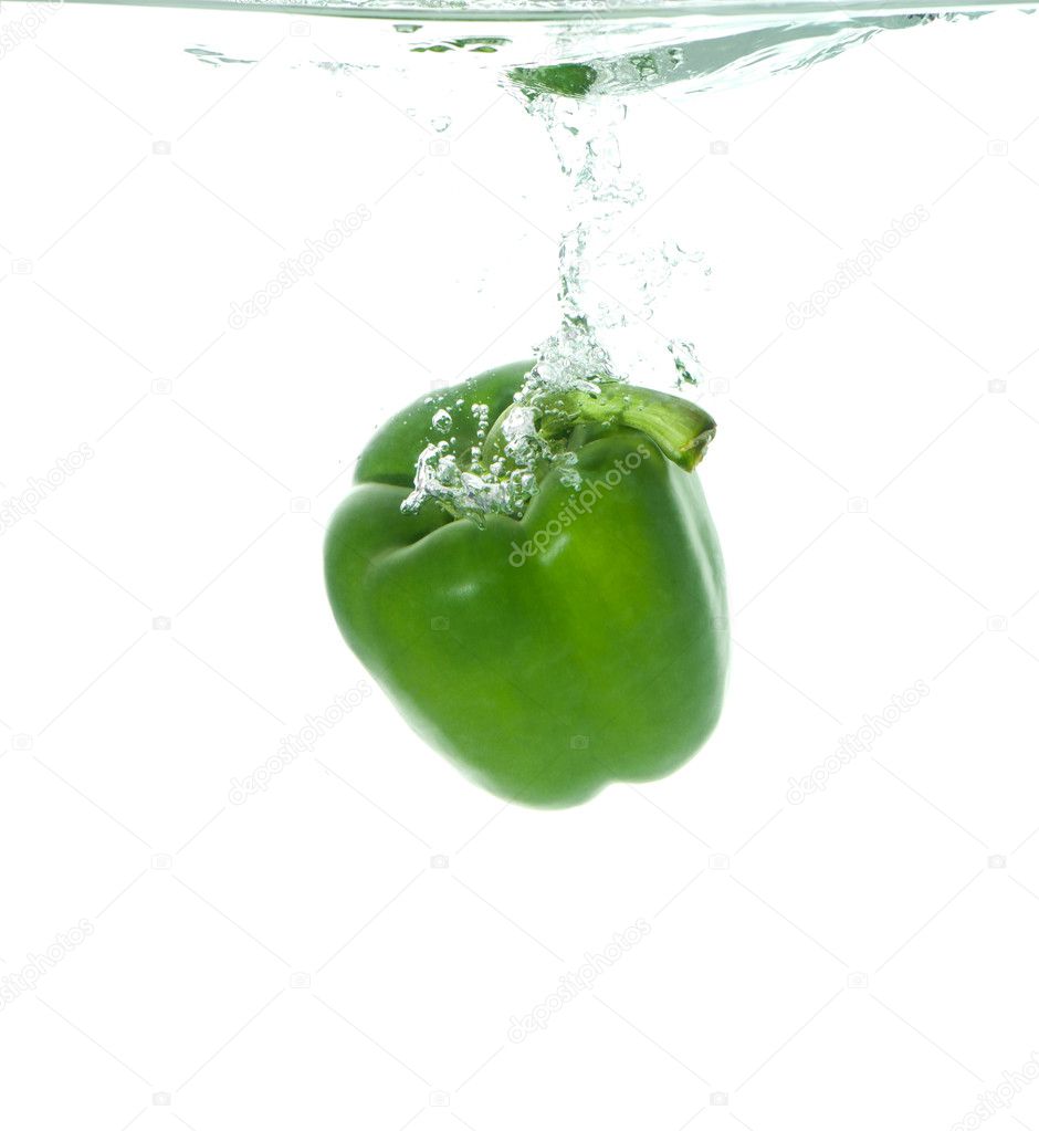 Green paprika in clear water