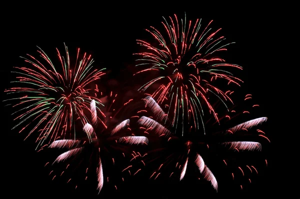 Explosions of green and red fireworks — Stock Photo, Image