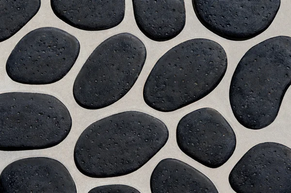 Background with black pebbles — Stock Photo, Image