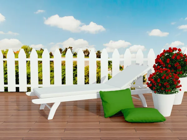 White sunlounger and roses. — Stock Photo, Image