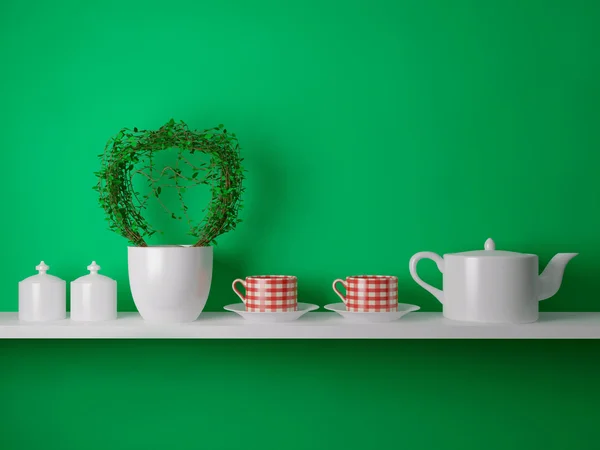 Чайник и чашки на полке — стоковое фото
