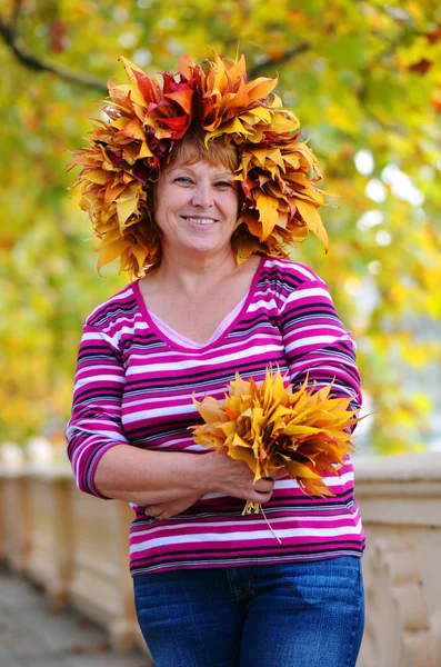 Happy woman in a wreath — Stock Photo, Image