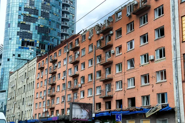 Broken, shelled windows. Buildings after being hit by missiles