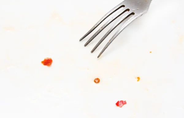 Abstract background. pieces of chili with a fork on a white back — Stock Photo, Image