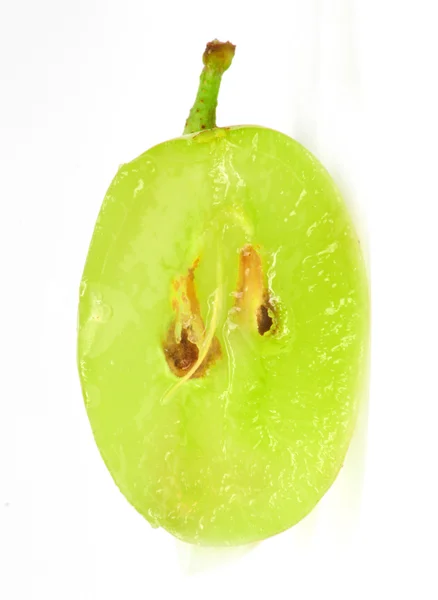 Φέτα ημιδιαφανές πράσινο γκρέιπ-φρουτ, μακροεντολή που απομονώνονται σε λευκό — Φωτογραφία Αρχείου