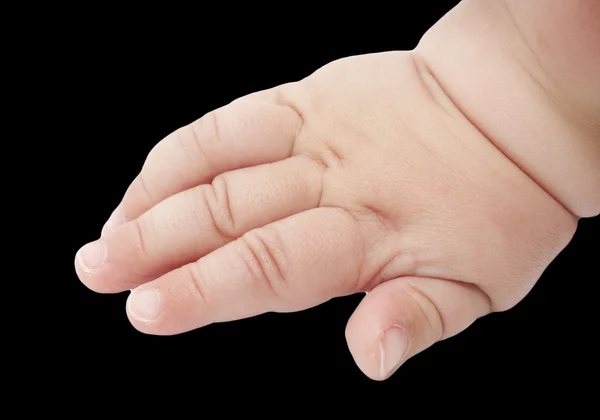 Baby's hand op een zwarte achtergrond — Stockfoto