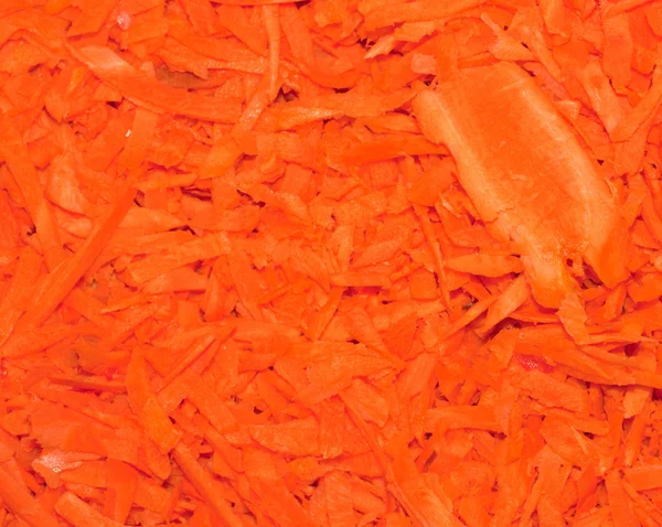 Grated carrots background. Close-up. — Stock Photo, Image