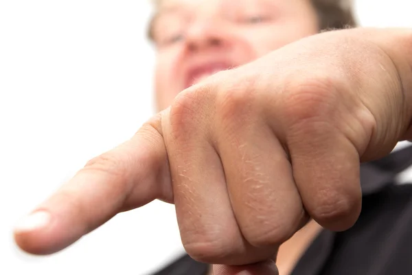Homem mostra seu dedo em um fundo branco — Fotografia de Stock