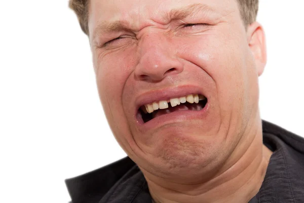 Hombre llorando sobre un fondo blanco — Foto de Stock