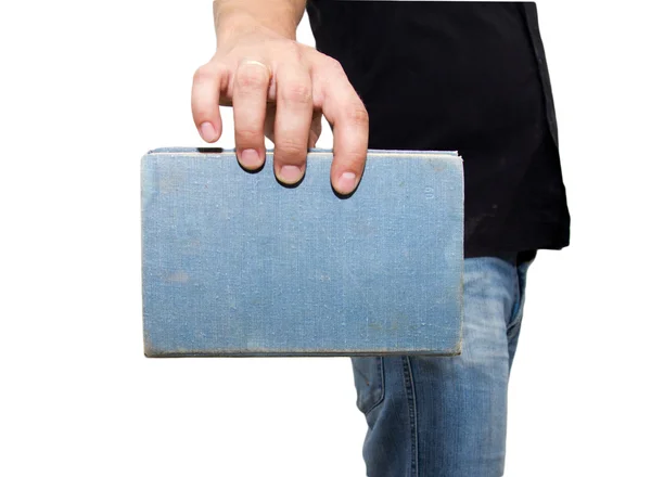 Homem segurando um livro em um fundo branco — Fotografia de Stock