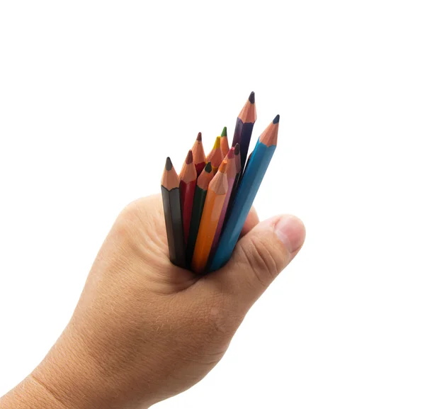 Colorful pencils in hand on a white background — Stock Photo, Image