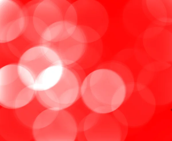 Feestelijke rode achtergrond bokeh van glare — Stockfoto