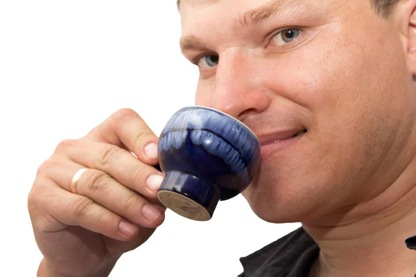 Man drinking tea on a white background — Stock Photo, Image