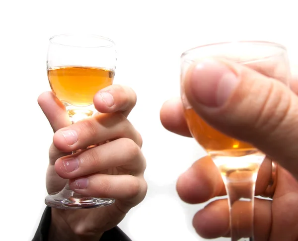 Gläser Champagner in den Händen der Wirtschaft auf weißem Hintergrund — Stockfoto