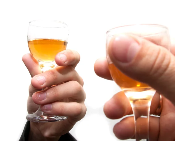 Verres de champagne dans les mains des entreprises sur fond blanc — Photo