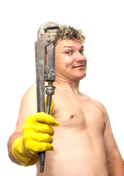 Wrench in yellow rubber gloves on white background — Stock Photo, Image