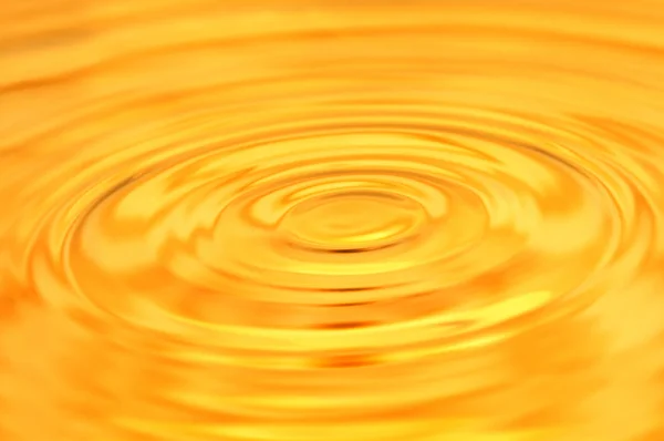 美しい黄金の水の背景。マクロ — ストック写真
