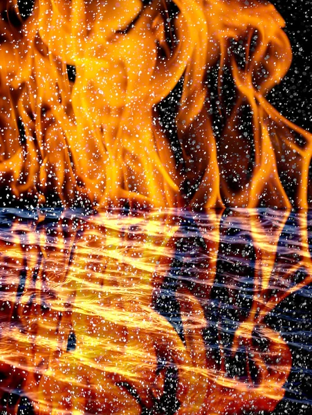 Snow on the fire background with reflection on water — Stock Photo, Image