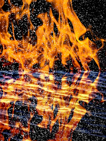 Snow on the fire background with reflection on water — Stock Photo, Image