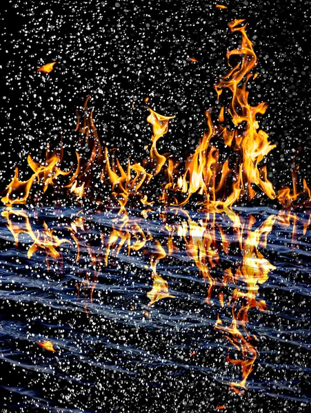 Snow on the fire background with reflection on water — Stock Photo, Image