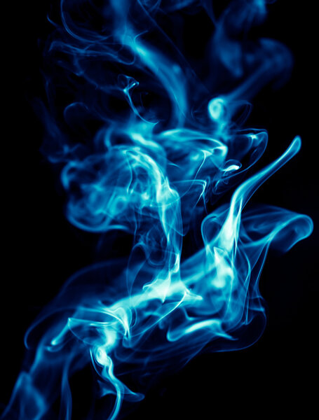 Blue smoke on black background