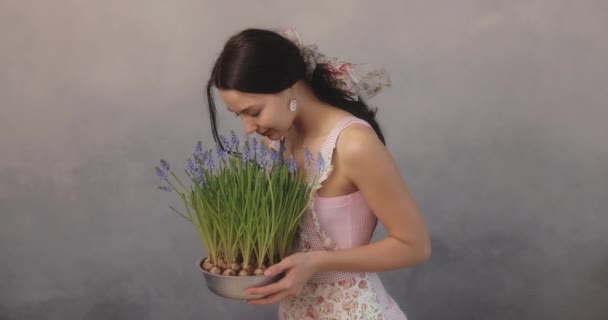 Woman Holding Bouquet of Flowers in Hands Indoors — Stock Video