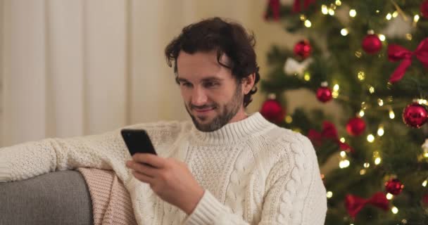 ( 영어 ) Human Celebration New Year Near Christmas Tree at Home, Using Smartphone — 비디오