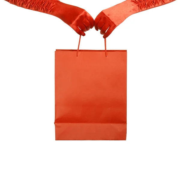 Elegant lady in red gloves holding shopping bag. Isolated over w — Stock Photo, Image
