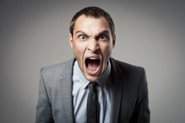 Angry businessman shouting clipart