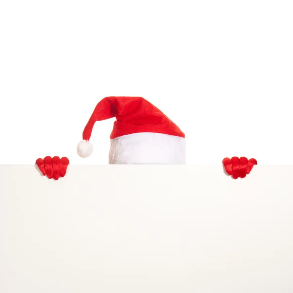 Ruce v červené rukavice a čepici Santa držet prázdné vizitky na bílém pozadí — Stock fotografie
