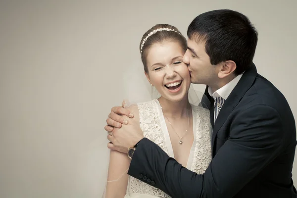 Gentle couple of lovers groom and bride. studio shooting at whit — Stock Photo, Image