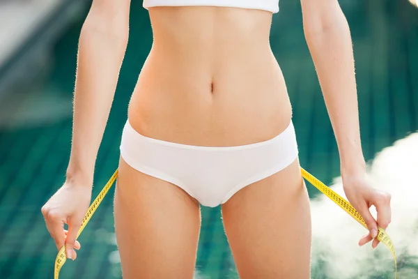 Woman measuring her waistline. Perfect Slim Body. Outdoor — Stock Photo, Image