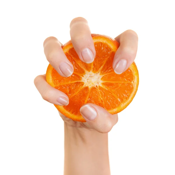 Laranja na mão da mulher. Isolado em um fundo branco — Fotografia de Stock