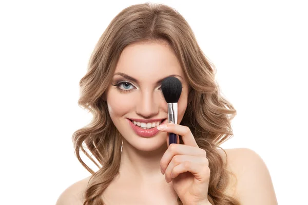 Portrait of a smiling woman with brush isolated — Stock Photo, Image