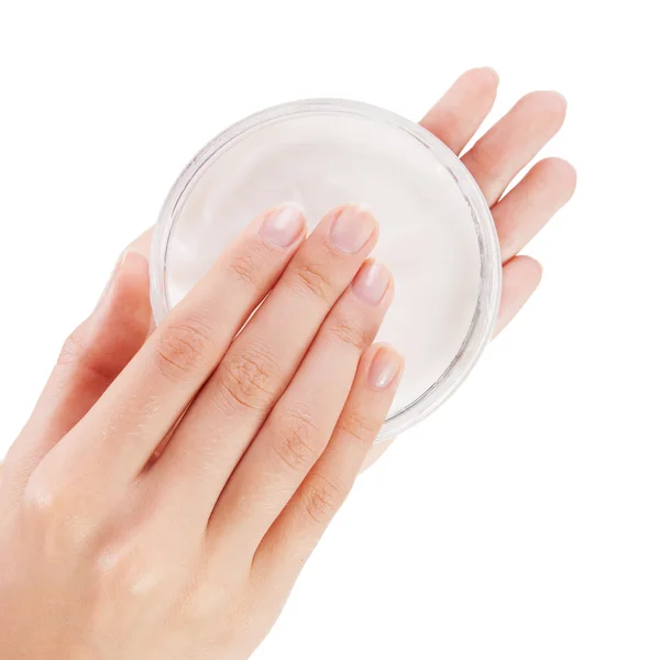 Mujer aplicando crema aislada sobre fondo blanco —  Fotos de Stock