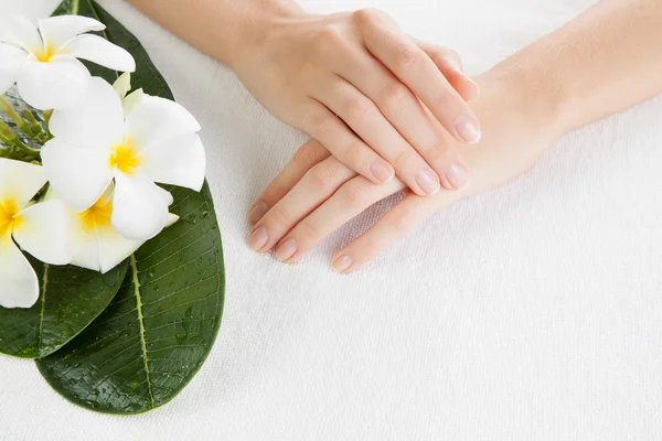 Beautiful woman hands are on a towel — Stock Photo, Image