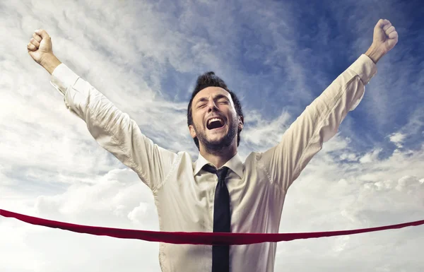 Businessman Crossing the Finish Line — Stock Photo, Image