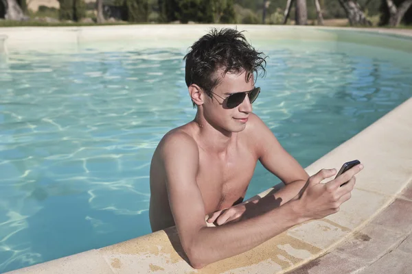 Texting a Message on a Pool — Stock Photo, Image