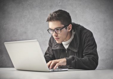 Boy Using his Laptop Computer clipart