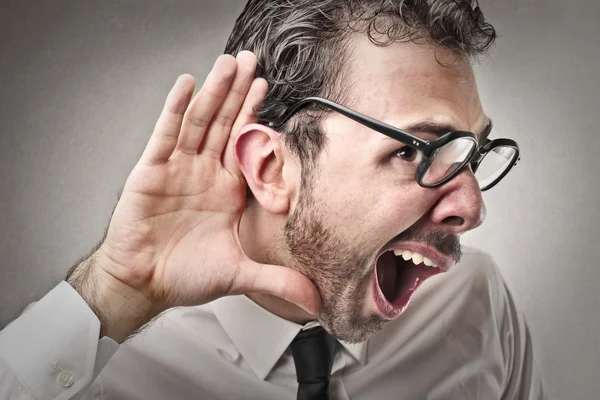 Businessman listening to something — Stock Photo, Image