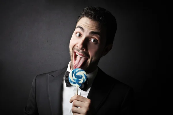 Man with a lollypop — Stock Photo, Image