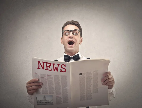 Businessman reading the news — Stock Photo, Image